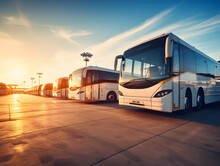 Image Of A Row Of Parked Travel Buses In A Bus Depot.