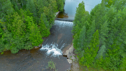 Wall Mural - Aerial view of a beautiful Canadian forest river in the province of Quebec