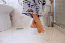 Cute Child, Boy, Sitting On The Toilet