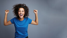 Young Happy Latin Woman Cheering At Soccer Sport Match, Blue T-shirt Hispanic Football Fan Supporter Smile Curly Hair Isolated On Gray Background