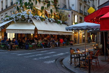 Wall Mural - cozy street with tables of cafe in paris, france. architecture and landmark of paris. cozy paris cit