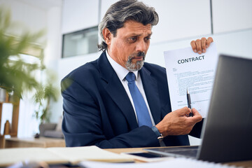 Canvas Print - Contract, video call and businessman with a document in the office talking to an online client. Discussion, paperwork and mature professional male lawyer in a virtual meeting on a laptop in workplace