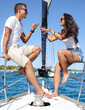 © Martin - Vertical photo of a couple enjoying themselves on a sailing yacht