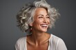 © Elen Nika - Portrait of a happy attractive mature woman with gray hair. Generative AI