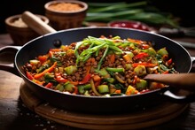 lentil and vegetable stir-fry in a wok