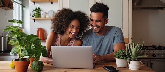 Multiracial couple doing online banking at home