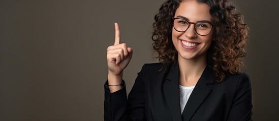 Poster - A happy white woman with a professional look and eyewear pointing with her hand while smiling at the camera