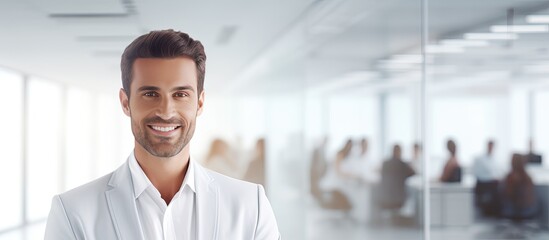 Smiling businessman in modern office with text space