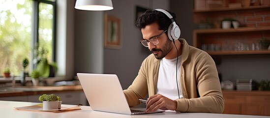Indian man watching webinar at home Western man learning online