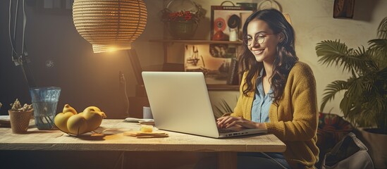 Wall Mural - Joyful youth operating laptop in residence