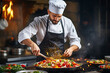 © colnihko - Male chef preparing vegetable vegetarian dish at a professional kitchen.