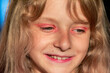 © Nataliia Makarovska - portrait of a smiling beautiful blonde girl with curly hair and pink makeup,