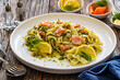 Tagliatelle with salmon and dill on wooden table
