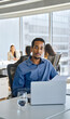 © insta_photos - Young African American business man bank account manager sitting at office work holding documents. Ethnic businessman worker looking at camera at workplace, vertical portrait.