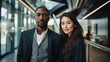 © brillianata - Asian woman and african man. Modern confident couple of employees