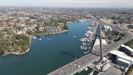 Canvas Print - Aerial drone rotation view of Anzac Bridge along the Western Distributor in Rozelle, in Sydney NSW on a sunny morning  