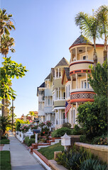 Wall Mural - Old Victorian houses on a street in Huntington Beach, Orange County, California