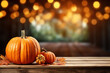 canvas print picture - Halloween, orange pumpkins on a wooden table on a bokeh glowing background, copy space