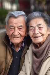 Wall Mural - a senior couple smiling happily at the camera and looking relaxed