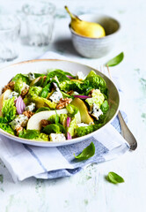 Wall Mural - French style autumn salad with pears, walnuts and blue cheese. Top view