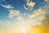 Fototapeta Pokój dzieciecy - Sky blue and orange light of the sun through the clouds in the sky