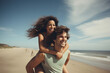 Couple enjoys a piggyback ride at the beach in summer