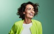 © hakule - happy 40 years old ultra beauty Caucasian, who is smiling and laughing, wearing bright clothes. green background, studio photos. created by generative AI technology.