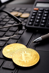 Wall Mural - Closeup of bitcoin on computer table