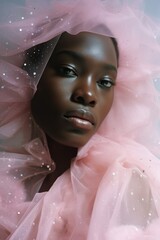 Wall Mural - A beautiful portrait of an afro american woman in a stylish pink dress, with wild tulle covering her head, captures the essence of her individual fashion and free spirit