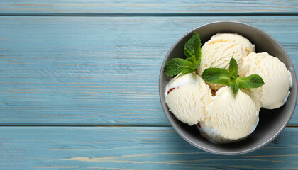 Wall Mural - Delicious vanilla ice cream and mint in bowl on light blue wooden table, top view. Space for text