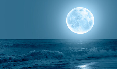 Aufkleber - Night sky with blue moon in the clouds sea wave in the foreground 