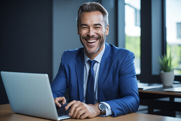 professional businessman in blue suit sitting at desk in office working on laptop computer, created with ai