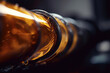 Macro shot of hydraulic oil flowing through a pipe with a blurred industrial background, showcasing its viscosity and fluid dynamics