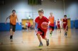 Young basketball players play with classic ball in sports hall. Basketball training for teenagers.