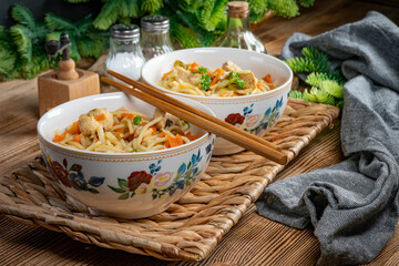 Wall Mural - Fried noodles with chicken and vegetables.