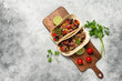 Mexican tacos with beef. Gray rustic background. Top view, flat lay.