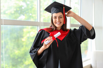 Sticker - Female graduate student with diploma near window in room