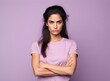 © Vladislava - Portrait of a lovely angry young Indian Asian girl wearing casual clothing standing isolated over pastel pink, purple, blue, yellow background, arms folded, ethnic, banner, jealous, AI Generated
