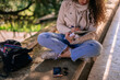 © qunica.com - Curly haired girl writing in notebook