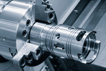 Metal Machine Tools Industry. CNC Turning Machine High-speed Cutting Is Operation.
