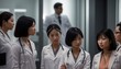 © useful pictures - Successful team of medical doctors are looking at camera and positive looking and smiling while standing in hospital