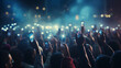 © JKLoma - A crowd of people at a live event, concert or party holding hands and smartphones up