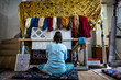 © Uldis Laganovskis - Woman is weaving beautiful carpet with Uzbekistan silk