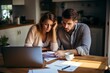 © Jorge Ferreiro - couple sitting in front of the computer