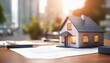 © ibreakstock - Futuristic real estate agency with holo 3d model of a small house on a table