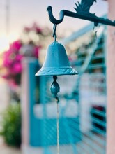 Antique Metal Blue Door Bell In Front Of A House