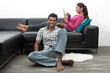 Indian couple on the sofa watching tv