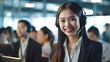 Asian woman working in call center office.