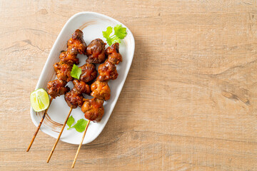 Wall Mural - grilled chicken gizzard skewer with herbs and spices