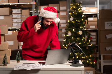 Santa Claus is working at warehouse for online seller, x-mas sale, dropshipping. Concept of small web business.